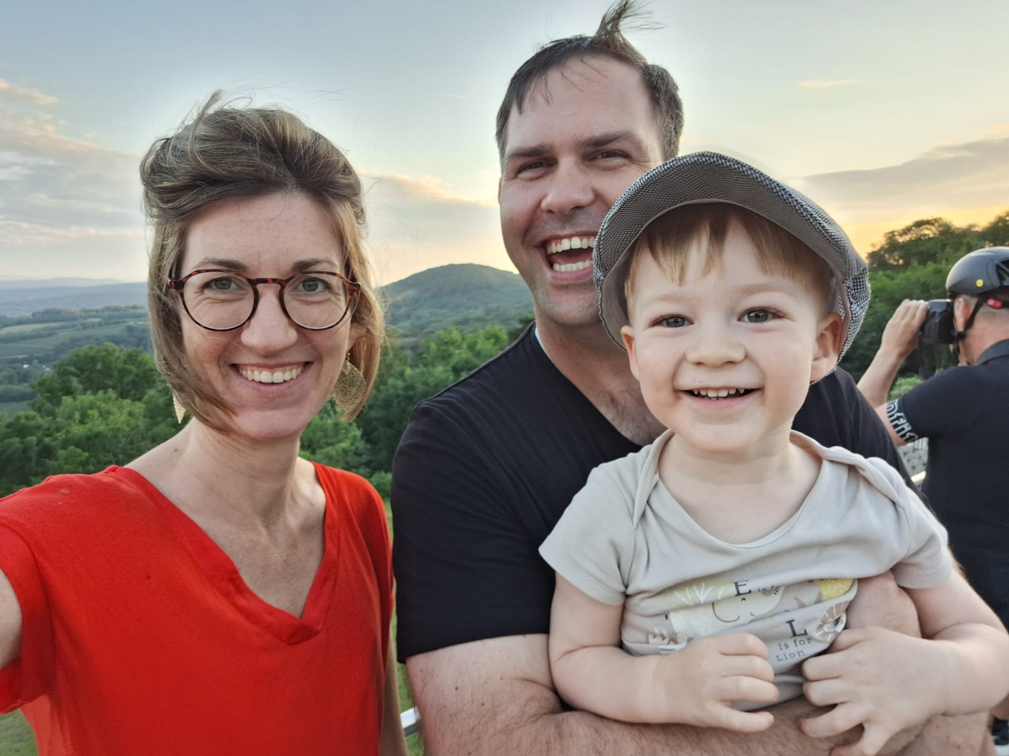 Diana, Stephan Winter, and their son together outdoors